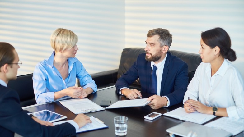 Personal injury lawyer in Atlanta negotiating settlement with insurance company representative