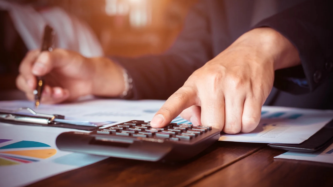 Calculator and legal documents representing hidden costs in a personal injury case