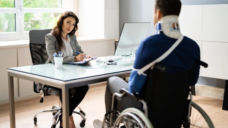 Personal injury lawyer explaining fees and legal costs to client.