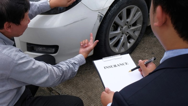 Insurance company reviewing police report for car accident claim