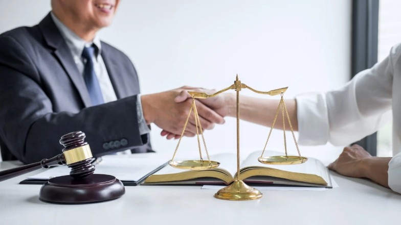 Personal Injury Lawyer helping accident victim with legal advice.
