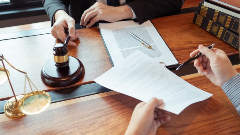 Auto accident lawyer helping client with property damage car accident claim in USA.