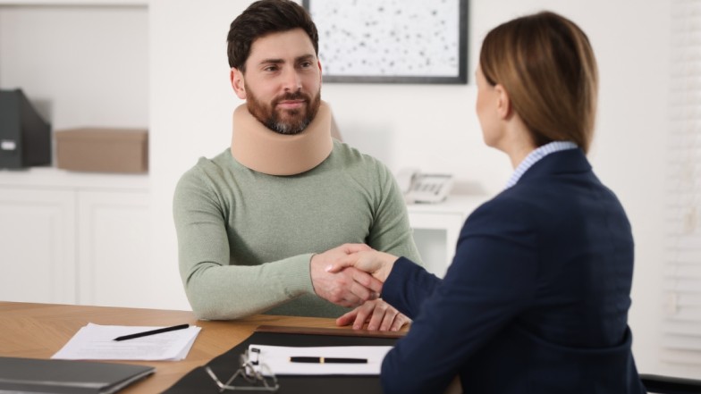Personal injury lawyer explaining comparative negligence and settlement process.
