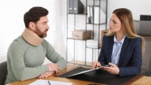 Personal injury attorney in Columbia giving legal advice to an injured client in office