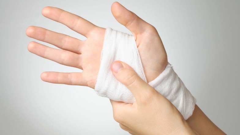 Dog bite injury victim with bandaged hand after an attack