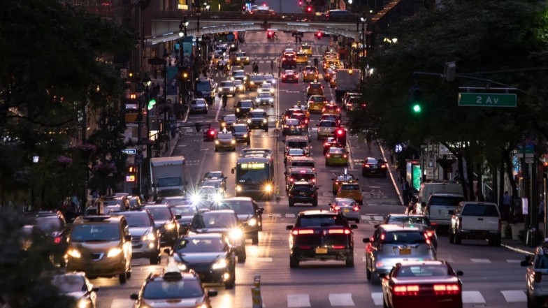 Busy New York street traffic with cars, representing frequent car accidents and the need for car wreck lawyers