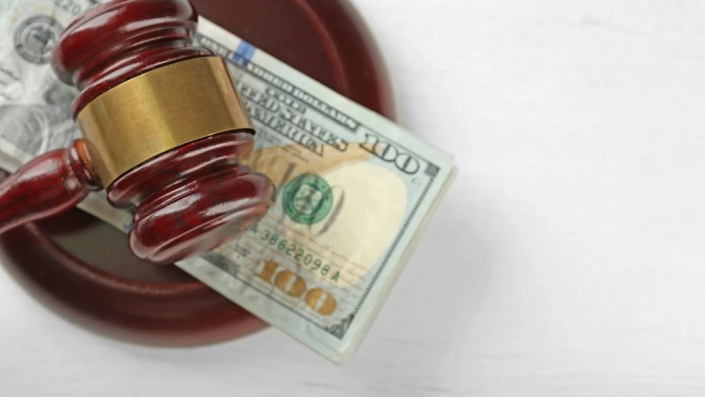 Criminal defense lawyer fees concept showing balance between justice and cost in New York