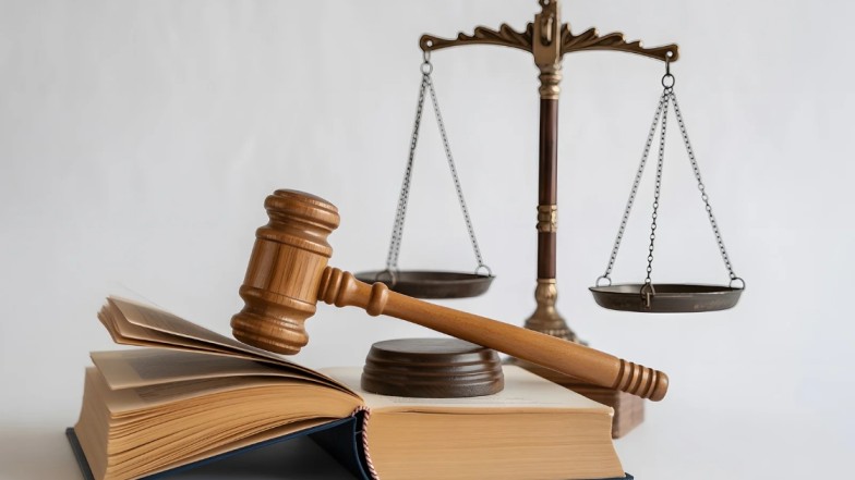 Scales of justice and gavel representing legal defense and justice system in New York